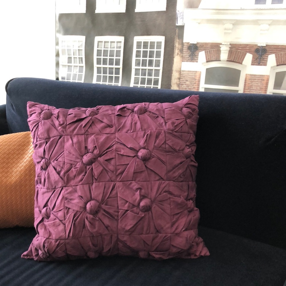 DKNY 18” square pillow. Dark purple pillow case with feather pillow included.